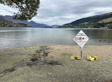 Health warning sewage spill Frankton Beach pollution public health no swimming sign March 2023