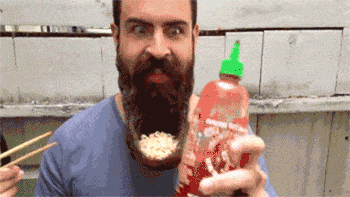 Man eating instant noodles from his beard