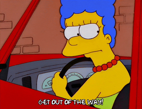 Marge Simpson with road rage and yelling to get out the way
