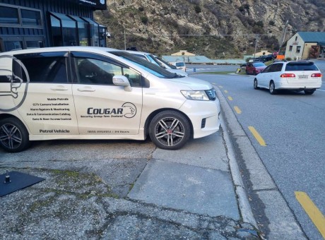 Cougar car on footpath