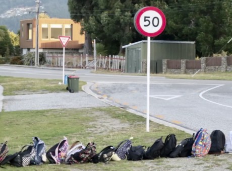 School bags lined up at a Kelvin Heights bus stop in Queenstown. Photo RNZ Katie Todd