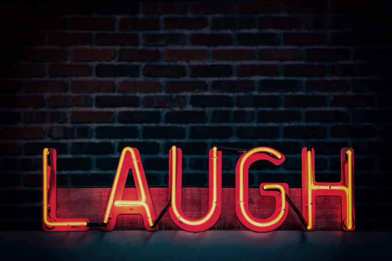 laugh neon light signage turned on 1115680